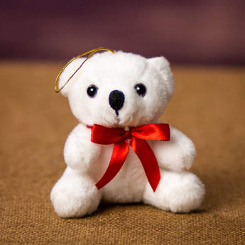 A white bear that is 3.5 inches tall while sitting