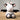 A black and white cow that is 11 inches tall while standing