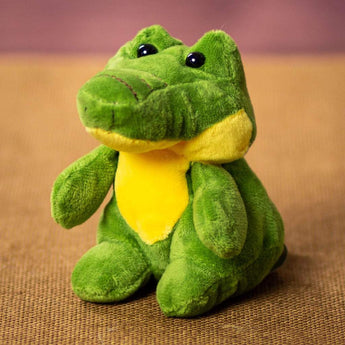 A green alligator that is 5 inches tall while sitting