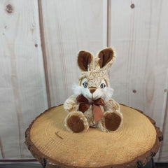 Video of small brown rabbit stuffed animal.