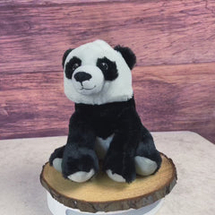 A black and white panda that is 10 inches tall while sitting