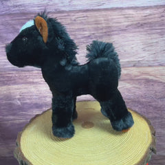 A black horse that is 10.5 inches tall from head to tail