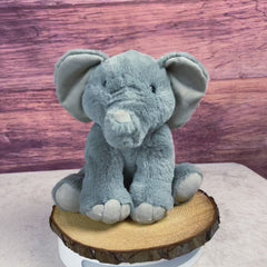 A gray elephant that is 10 inches tall while sitting