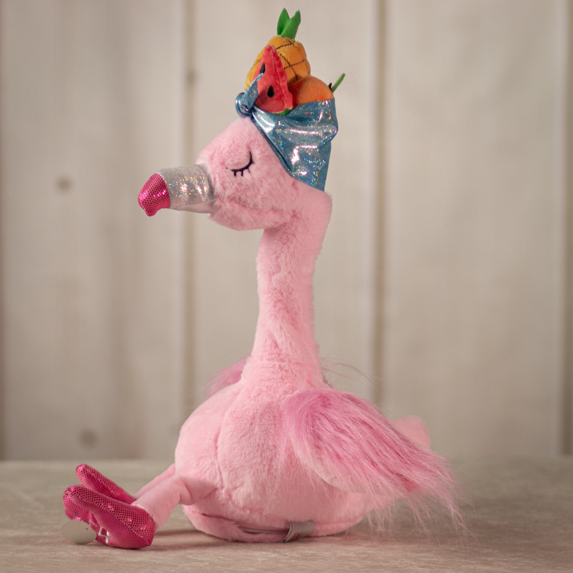 17" Paradise Flamingo in pink wearing a fruit hat that dances