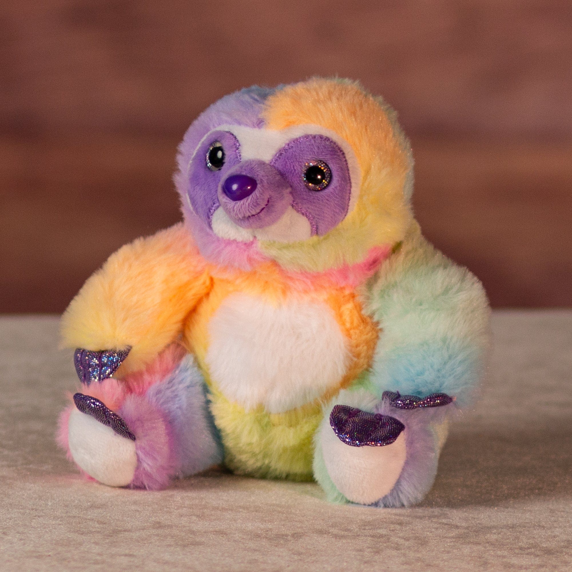 6 in rainbow sherbet sloth with purple glitter hands and feet