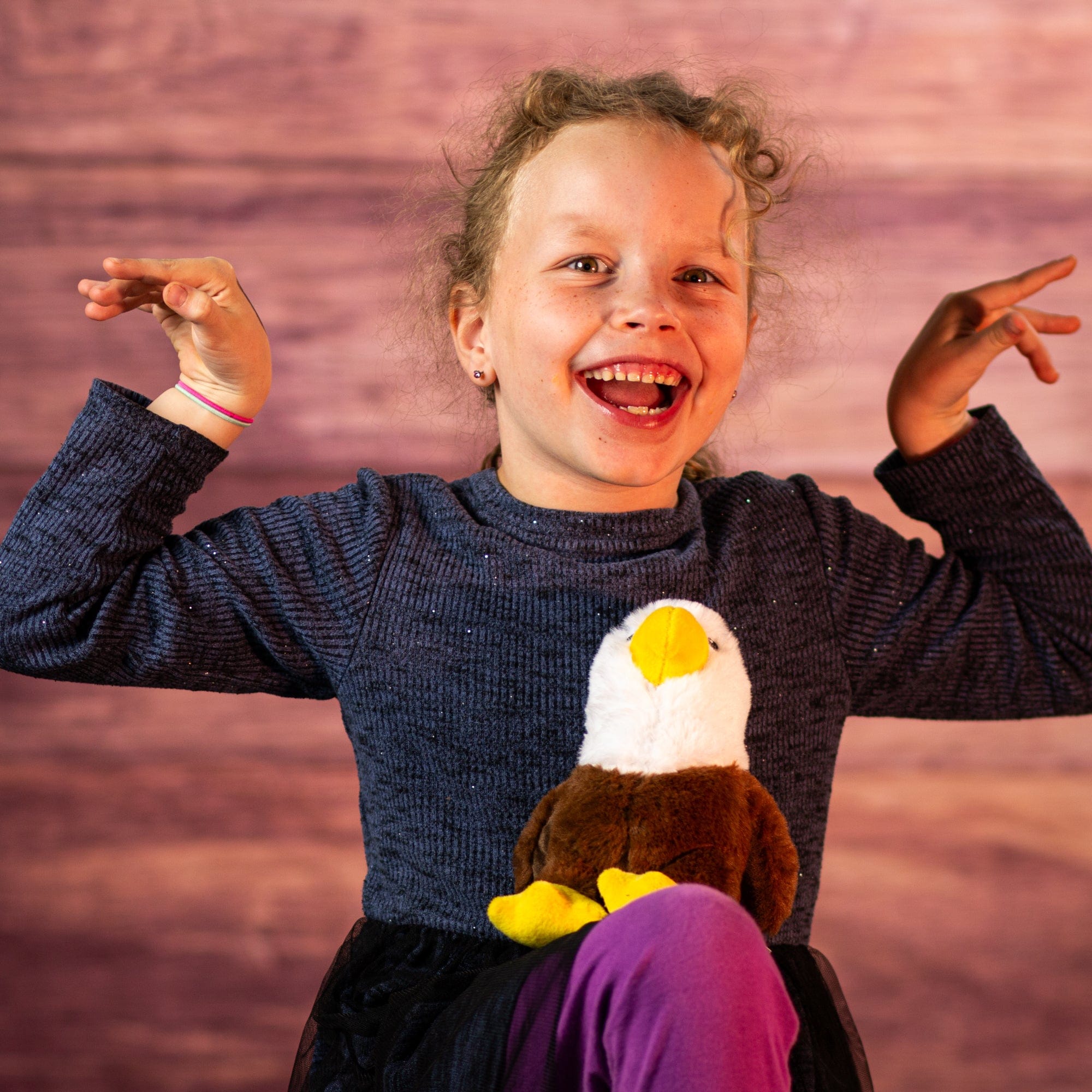 girl with 7 in stuffed bald eagle 