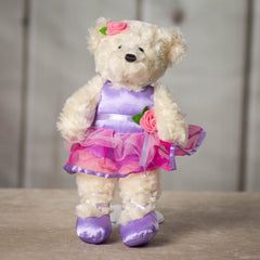 14" stuffed cream ballerina bear wearing a pink and purple leotard and tutu with a pink rose and purple ballet flats