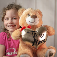 girl holding 15" Bigtime Te Amo Bear Duo with gold heart and red bow with heart feet