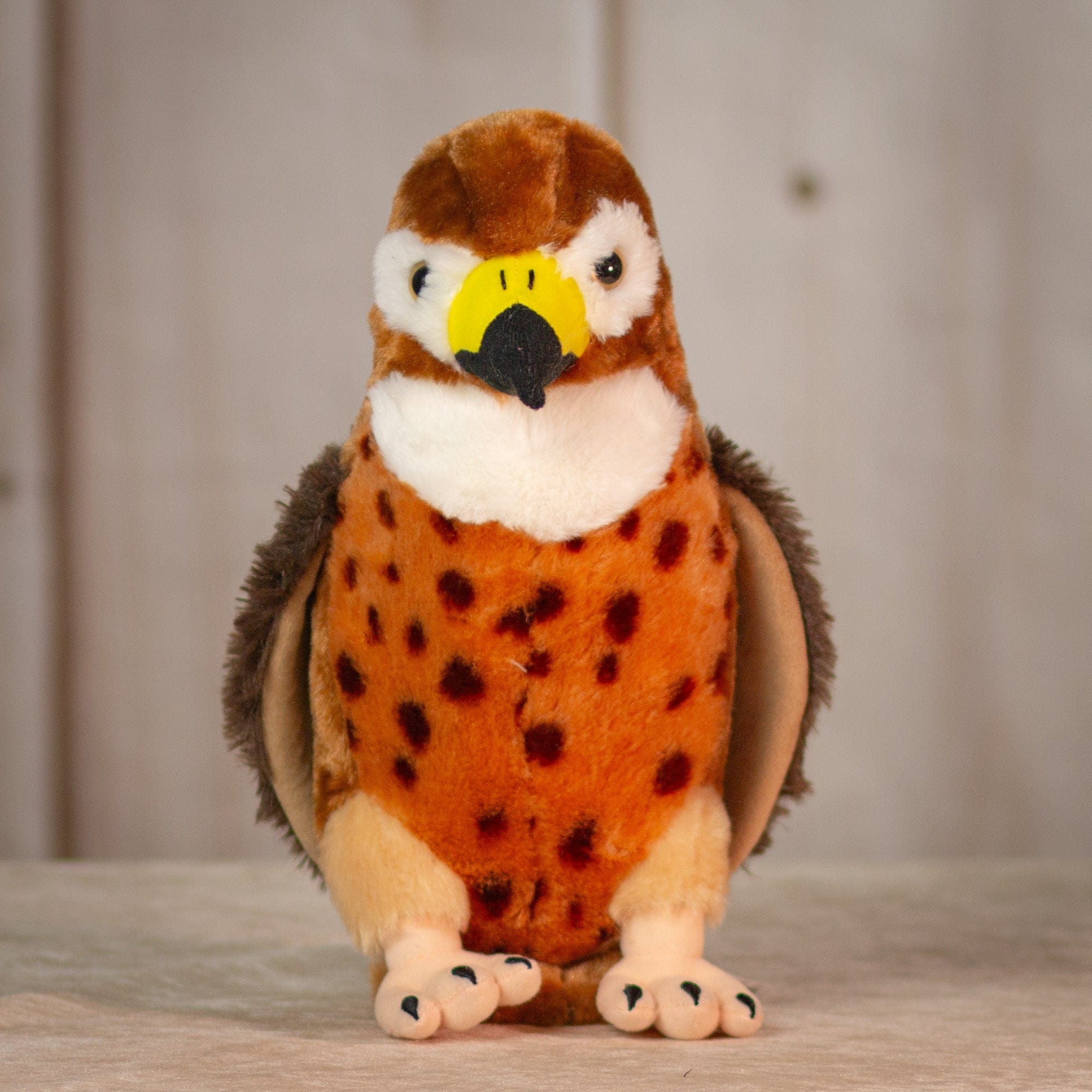 12" stuffed Great Hawk with yellow beak and spotted chest