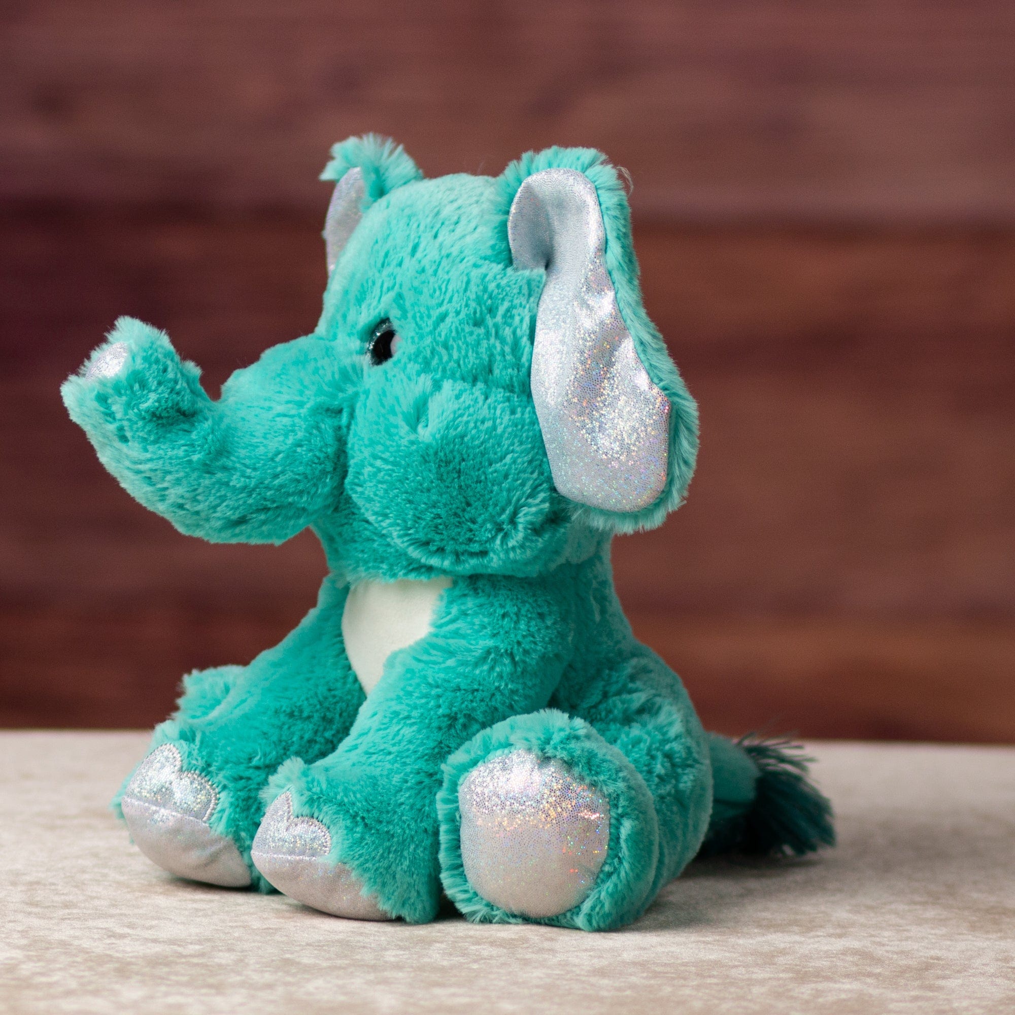 10 in stuffed blue elephant with glitter eyes and glitter ears and paws