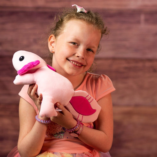 girl holding 10.5 stuffed pink axolotl