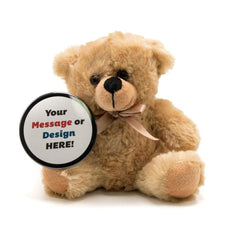 A beige bear holding a black button