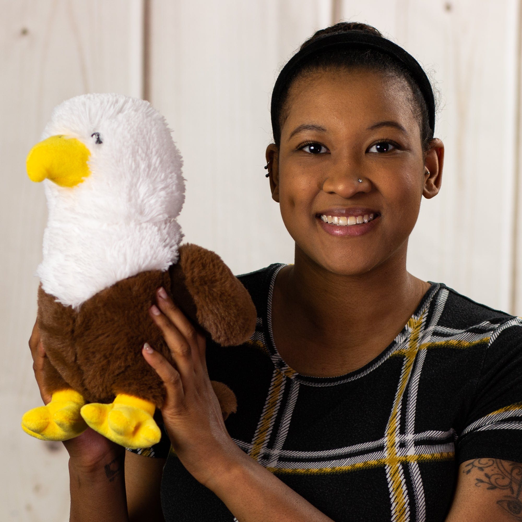 woman holding 10 in stuffed eagle