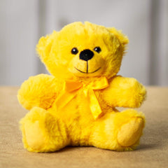 A yellow bear that is 6 inches tall while sitting