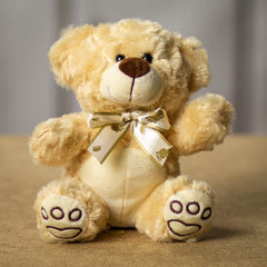 A beige bear that is 7 inches tall while sitting