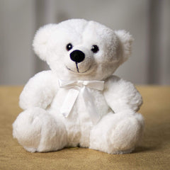 A white bear that is 6 inches tall while sitting