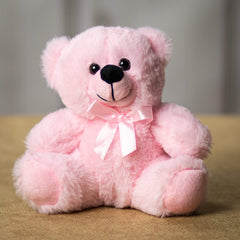 A pink bear that is 6 inches tall while sitting