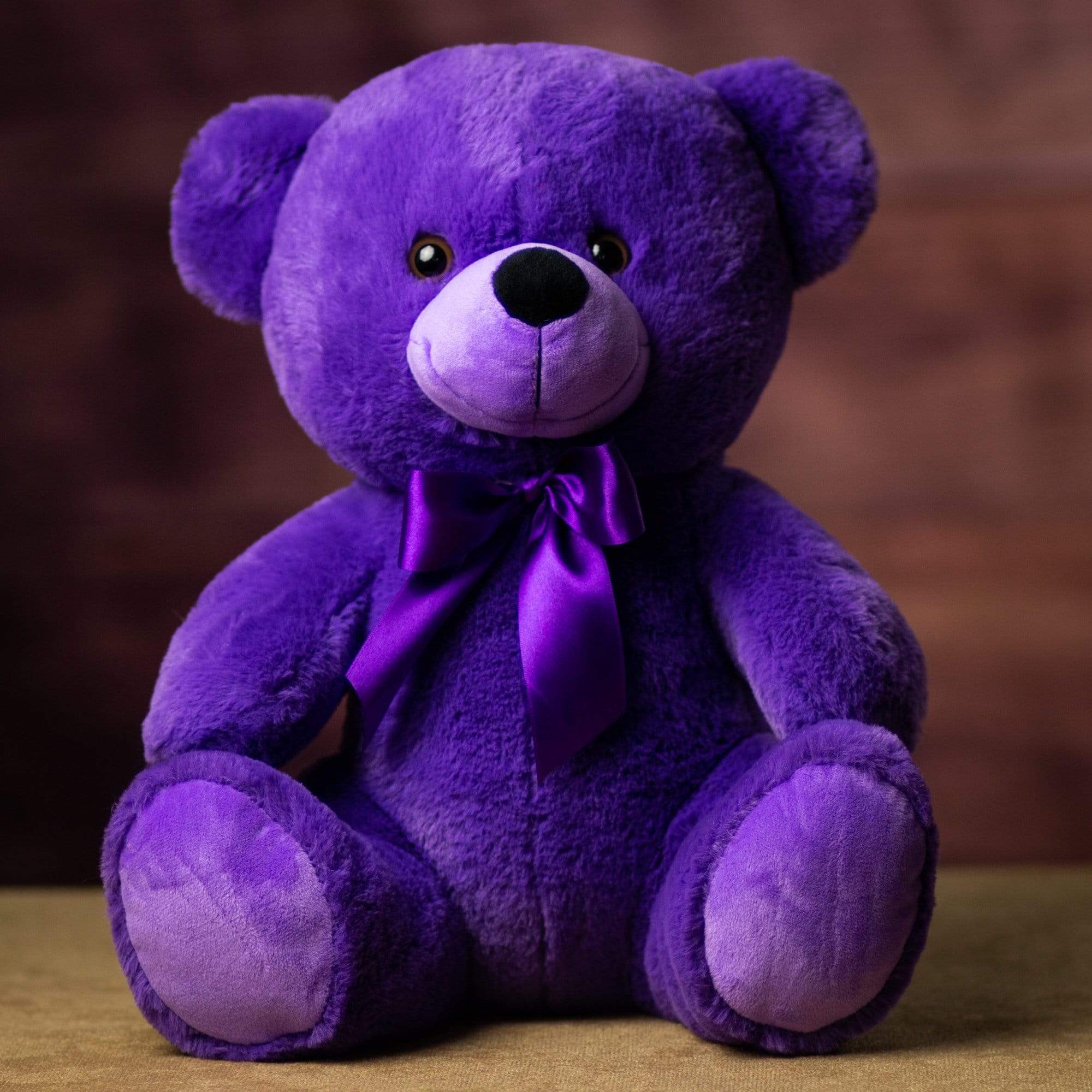 Teddy bear in purple colour on sale