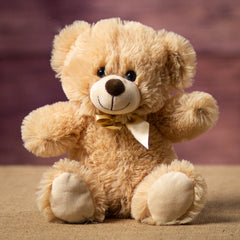 A beige bear that is 10 inches tall while sitting