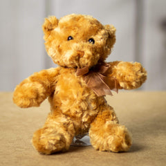 A beige bear that is 10 inches tall while standing