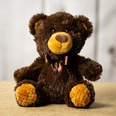 A dark brown bear that is 10.5 inches tall while sitting