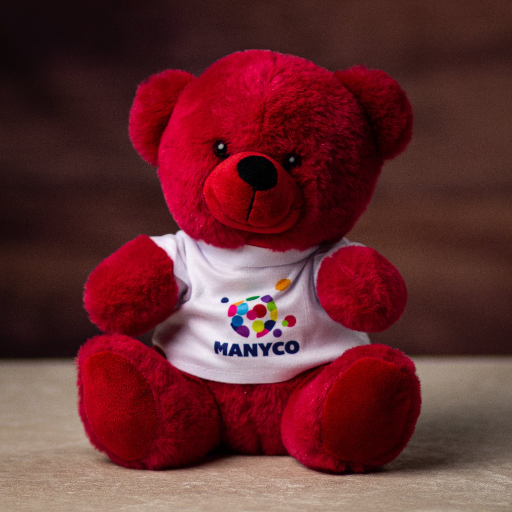 A red bear wearing a white custom printed t shirt