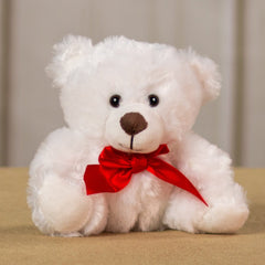 A white bear that is 6 inches tall while sitting