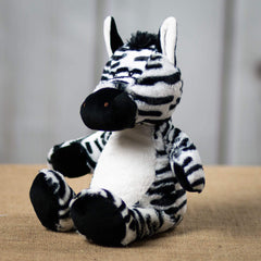 Side angle of a black and white stripped zebra that is 13 inches tall while standing