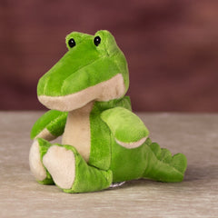 A green alligator that is 5 inches tall while sitting