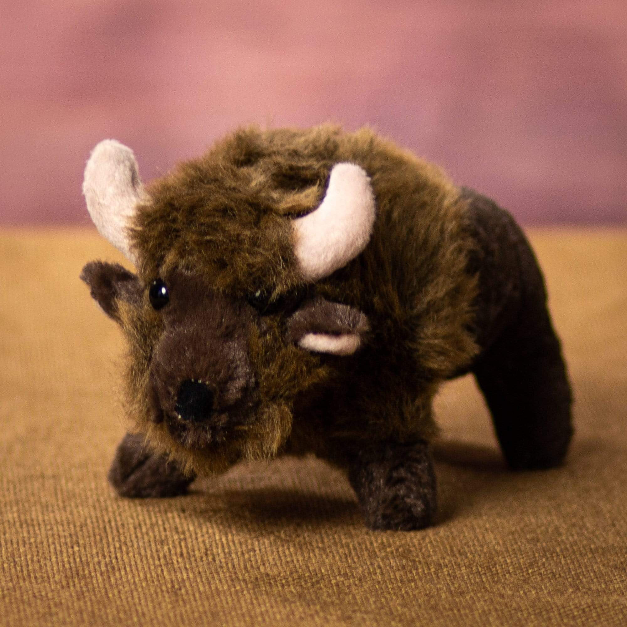 A brown buffalo that is 9 inches from head to tail