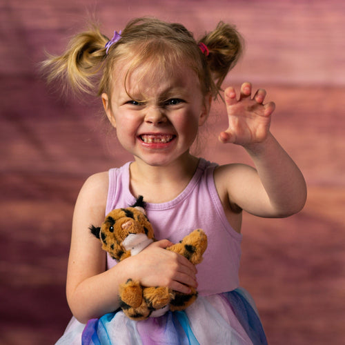 girl holding 6 in stuffed bobcat