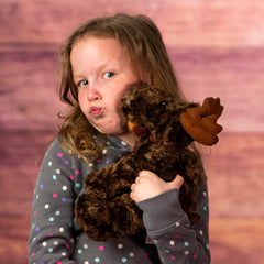 girl holding 9 in stuffed big brown moose with bow 