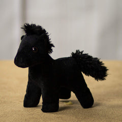 A standing black horse that is 5.5 inches from head to toe