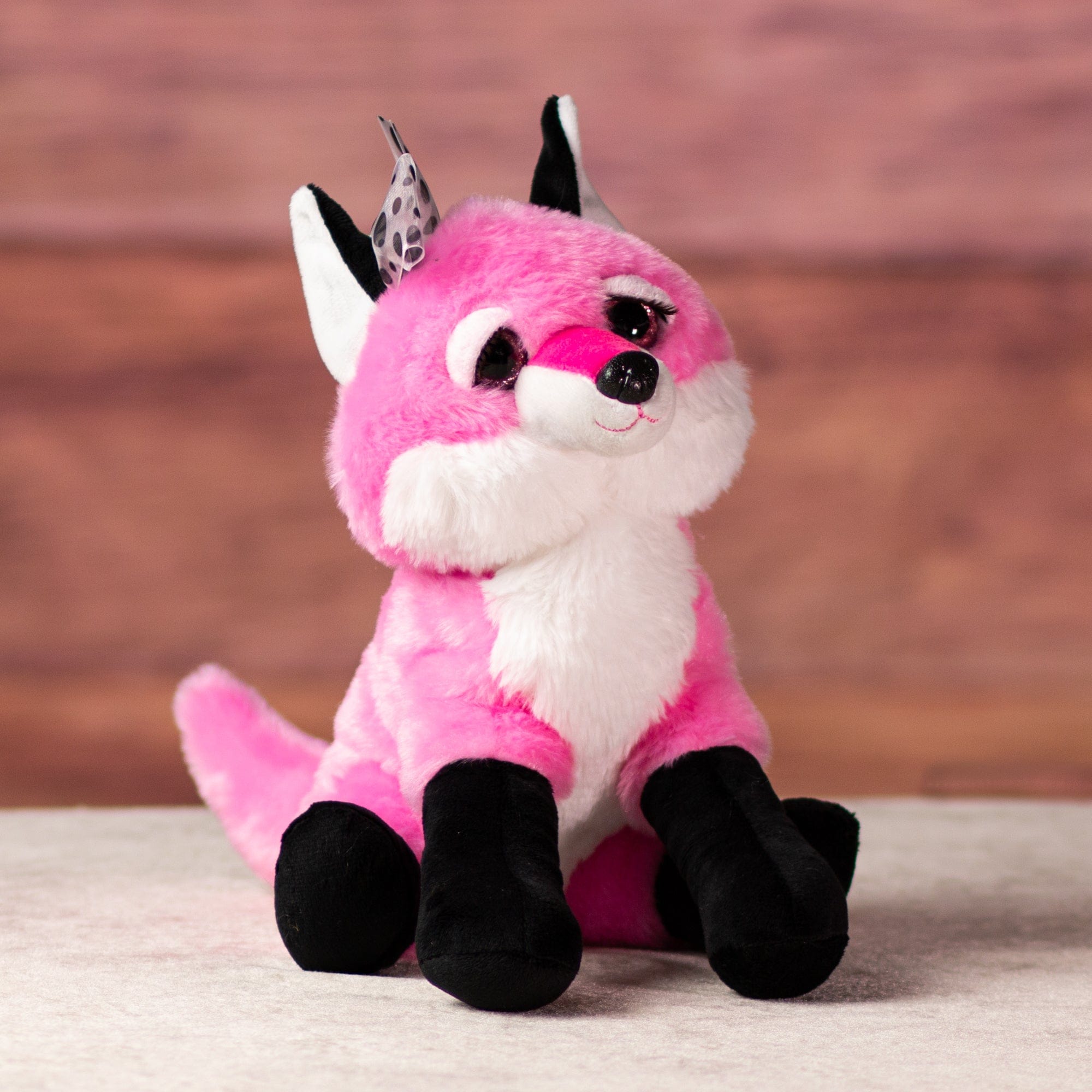 10 in stuffed pink fox with bow and pink glitter eyes