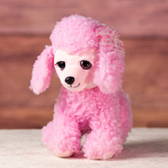 stuffed 10 in pink poodle with pink glitter eyes and eyelashes wearing a bow